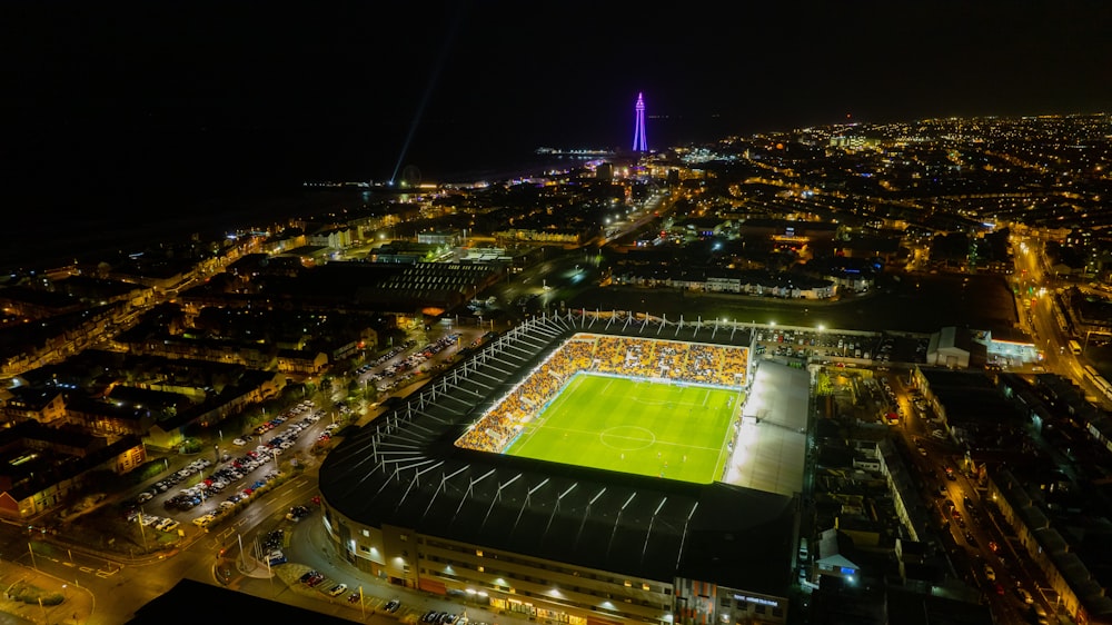 an aerial view of a soccer stadium at night