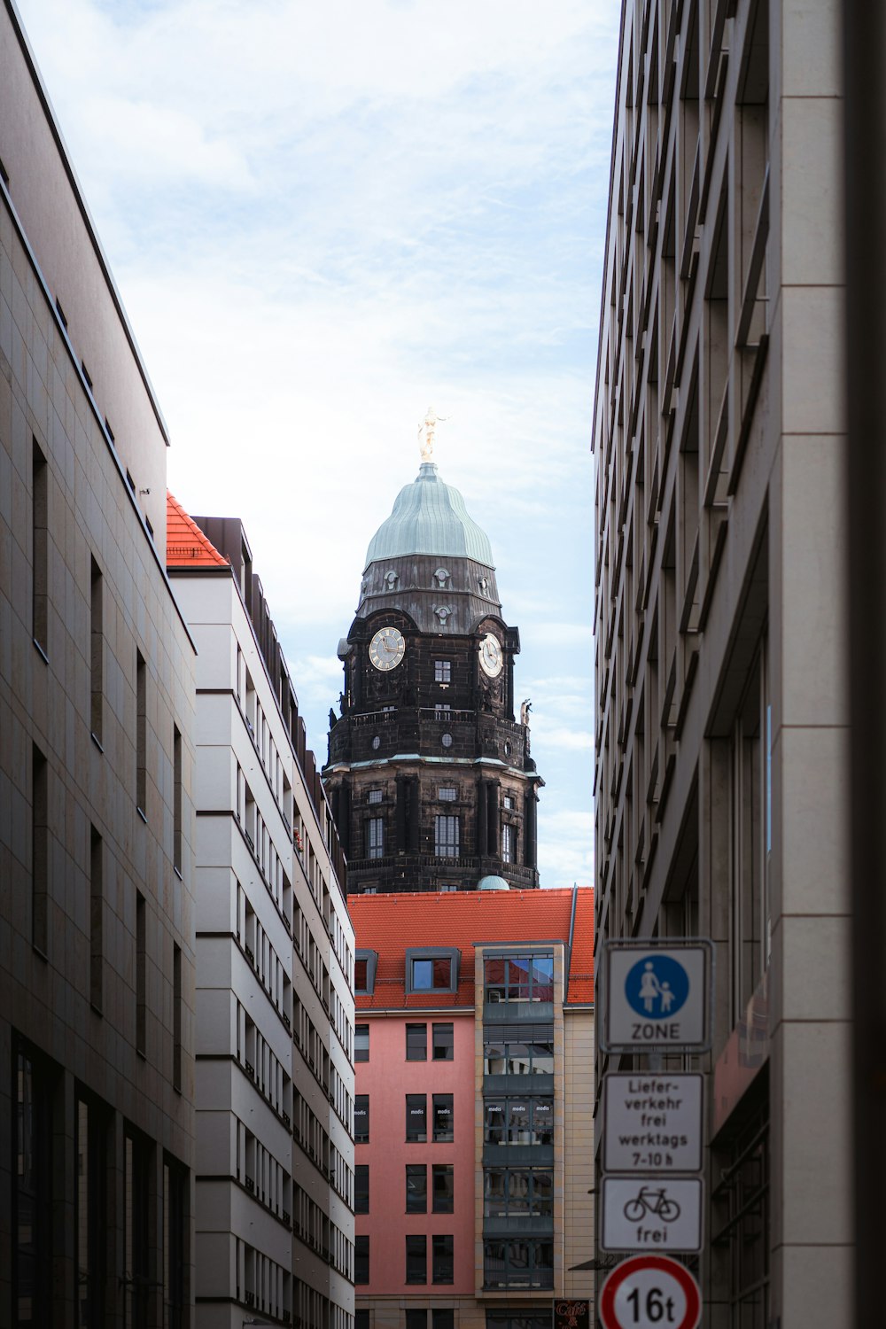 a large clock tower towering over a city