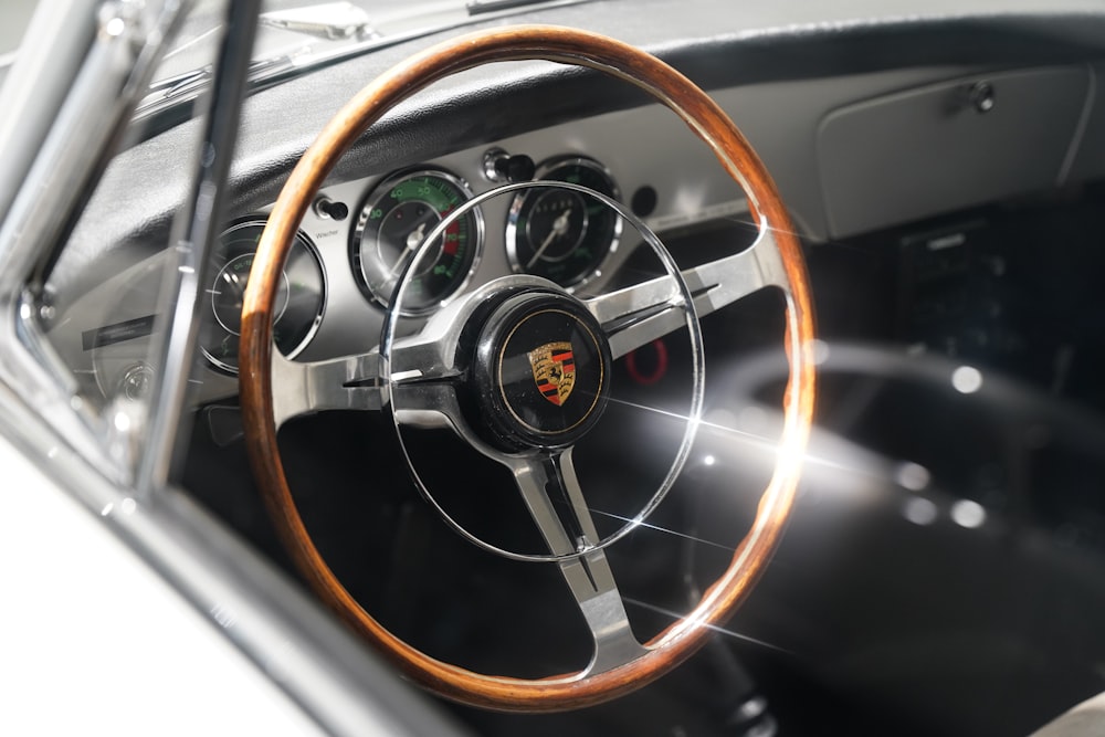 a close up of a steering wheel and dashboard of a car