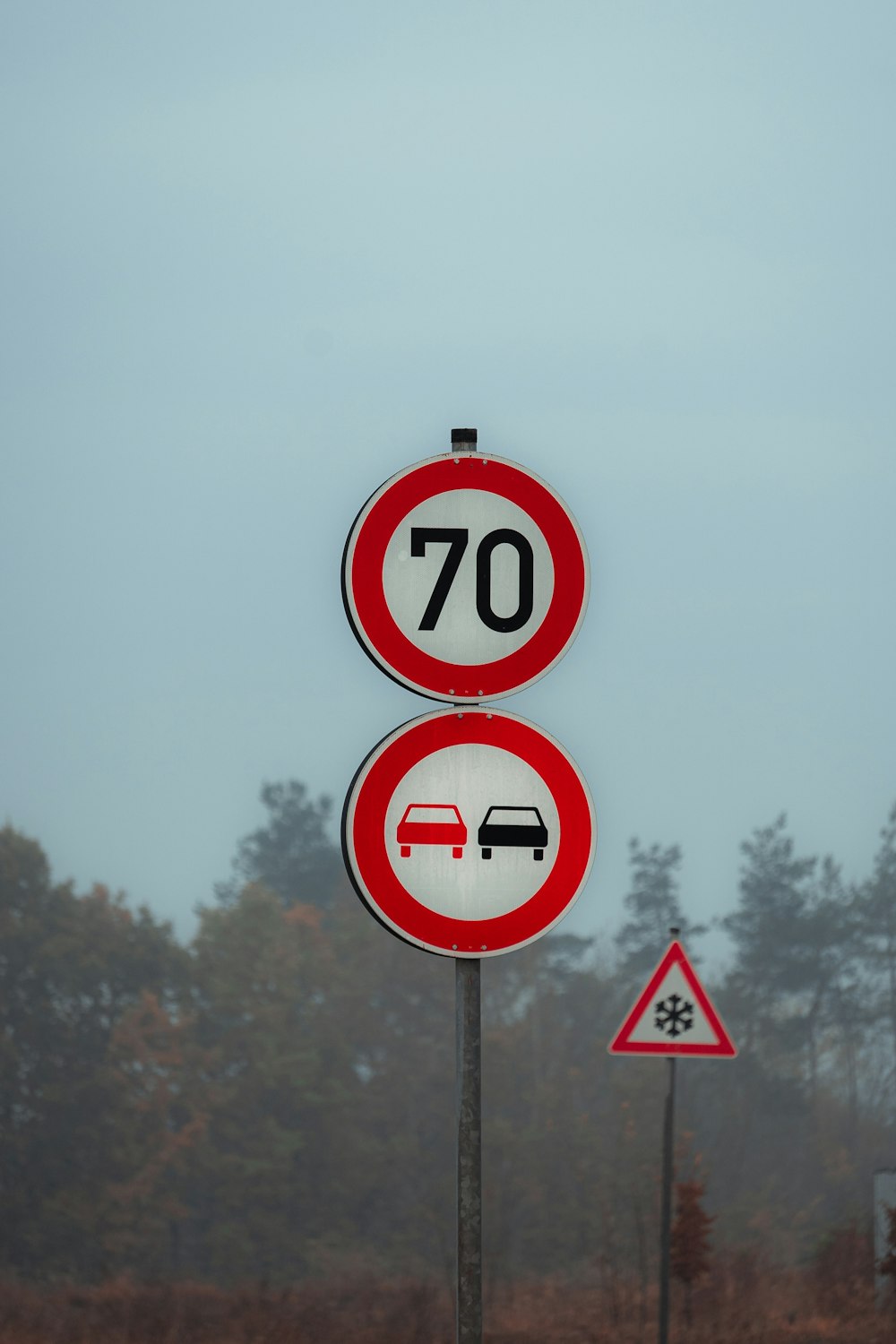 a couple of red and white signs sitting next to each other