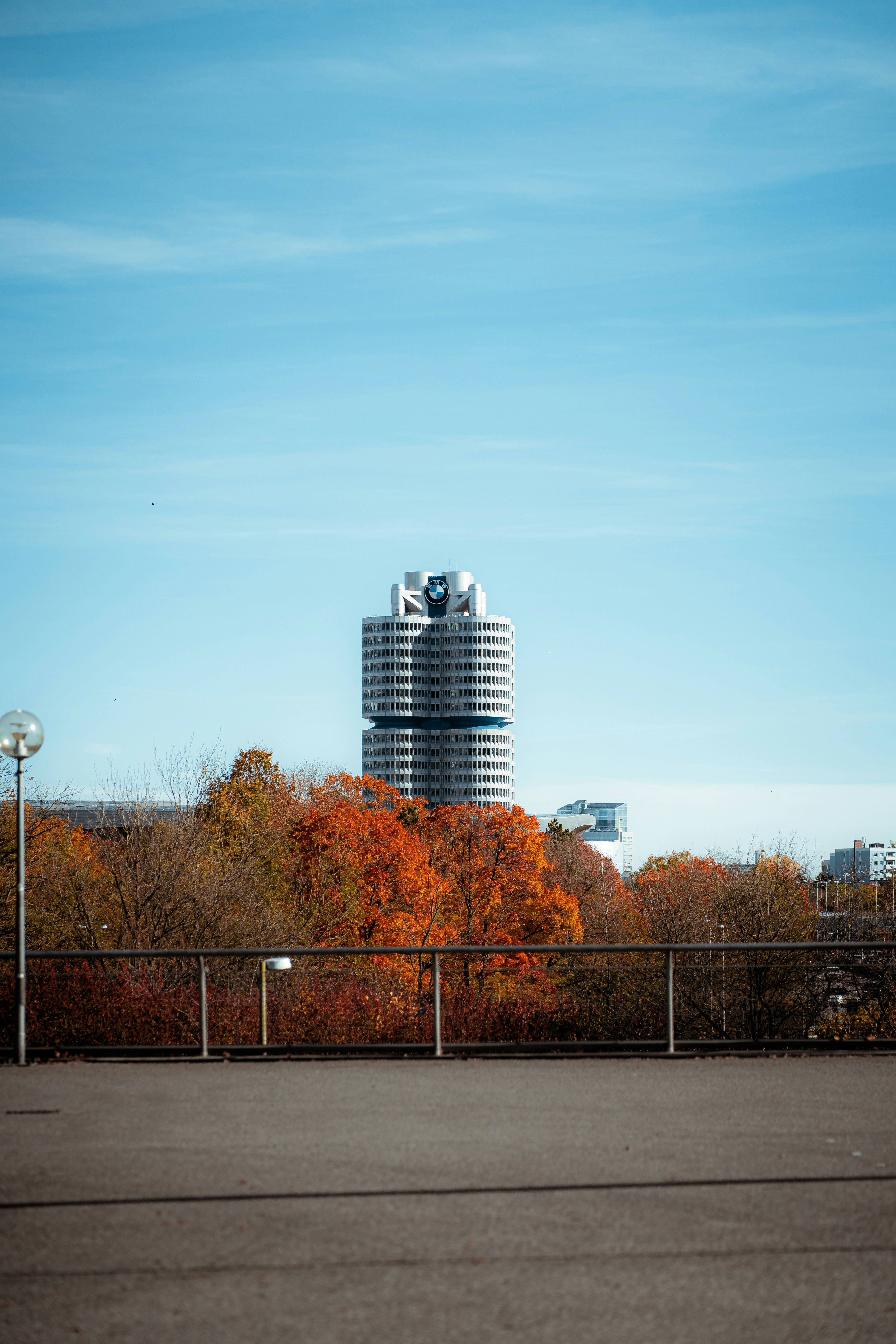 a man riding a skateboard down a street next to a tall building