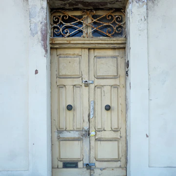 Before and after shots of a freshly maintained exterior door and frame.