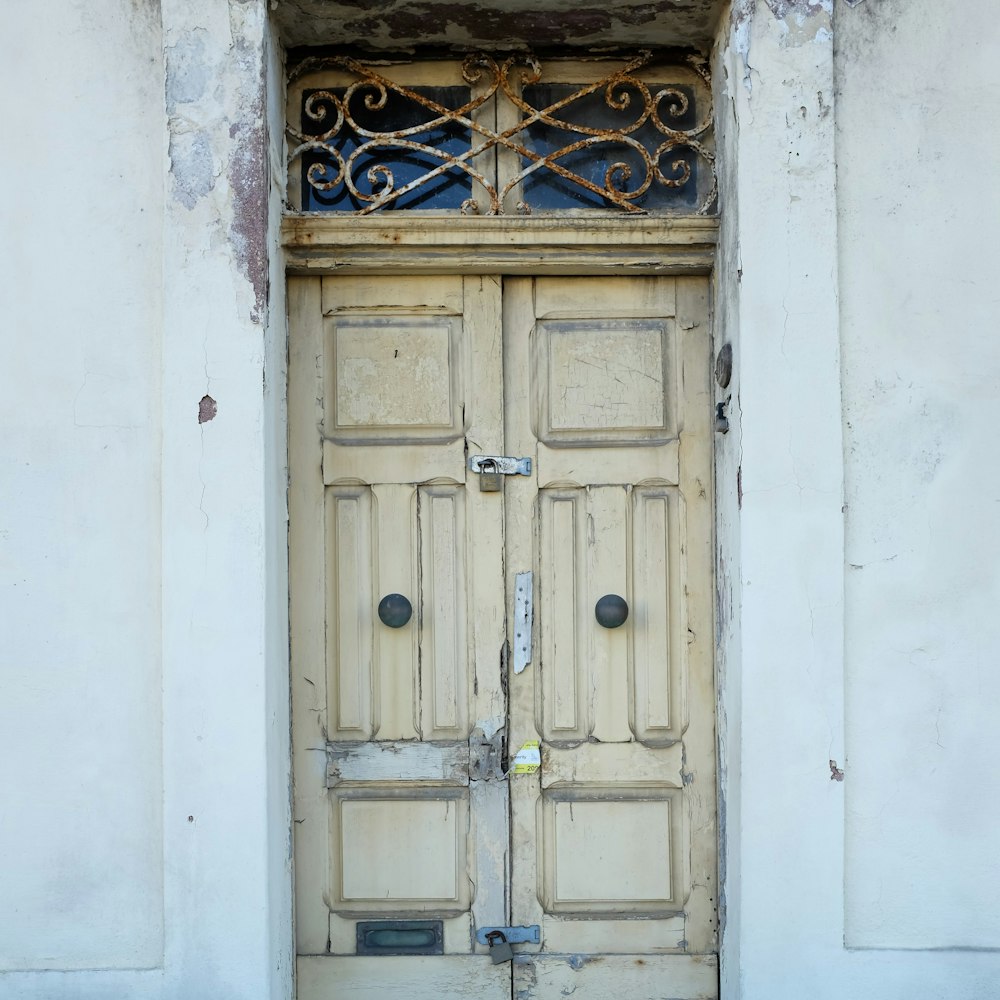 an old wooden door with wrought iron bars