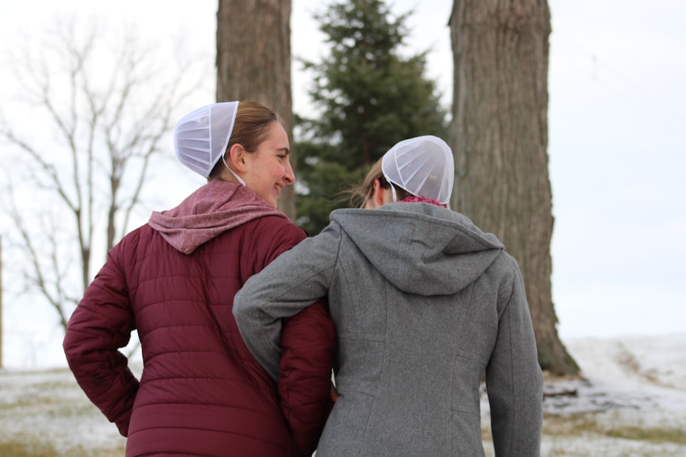 a couple of women standing next to each other