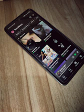 A sleek smartphone screen displaying multiple music streaming app icons with a play button.