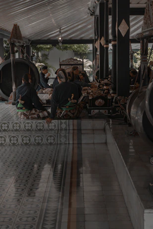 A warmly lit traditional Mardin interior with musicians playing the ney and saz.