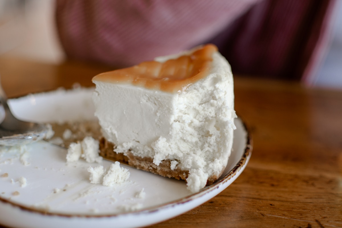 How Can You Make a Cheesecake Look Like a Wheel of Cheese with Browned Sides?