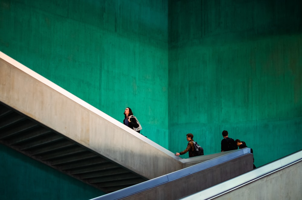 a couple of people that are standing on some stairs