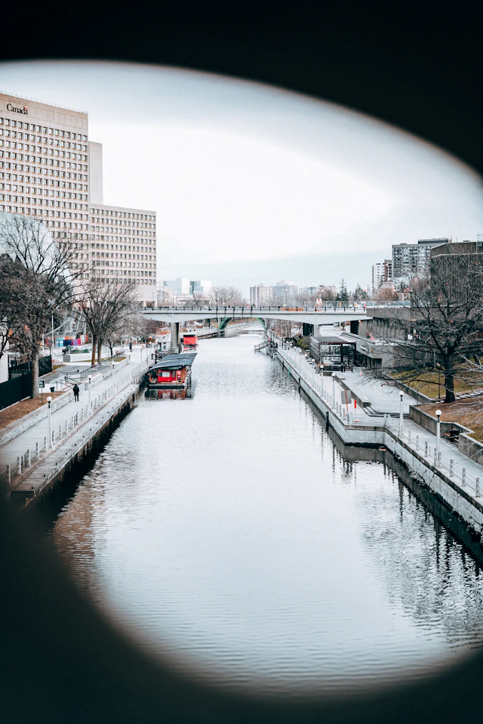 Rideau Canal waterway winding between city buildings in Ottawa, a calm setting for a first meeting after online dating