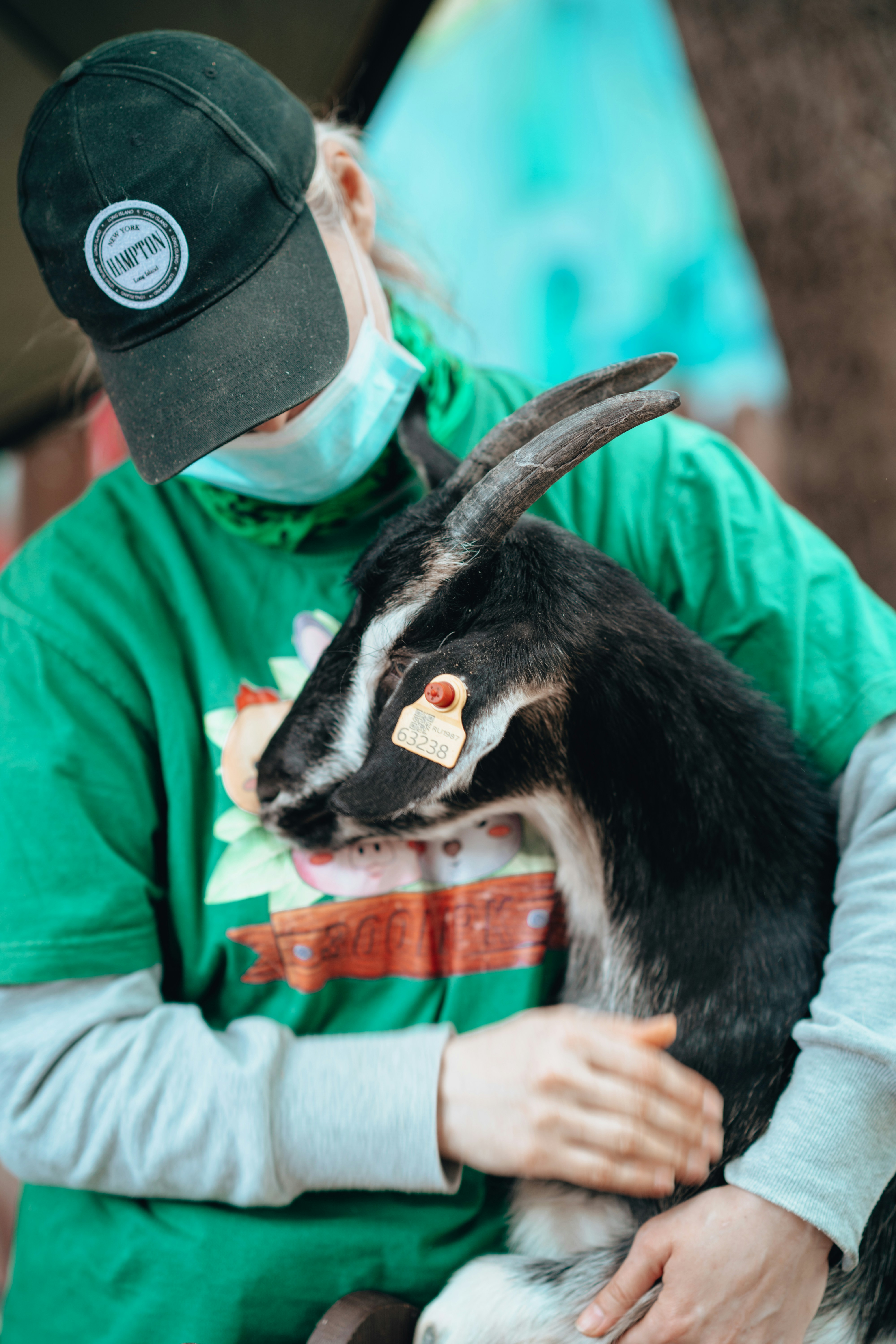 a person holding a goat