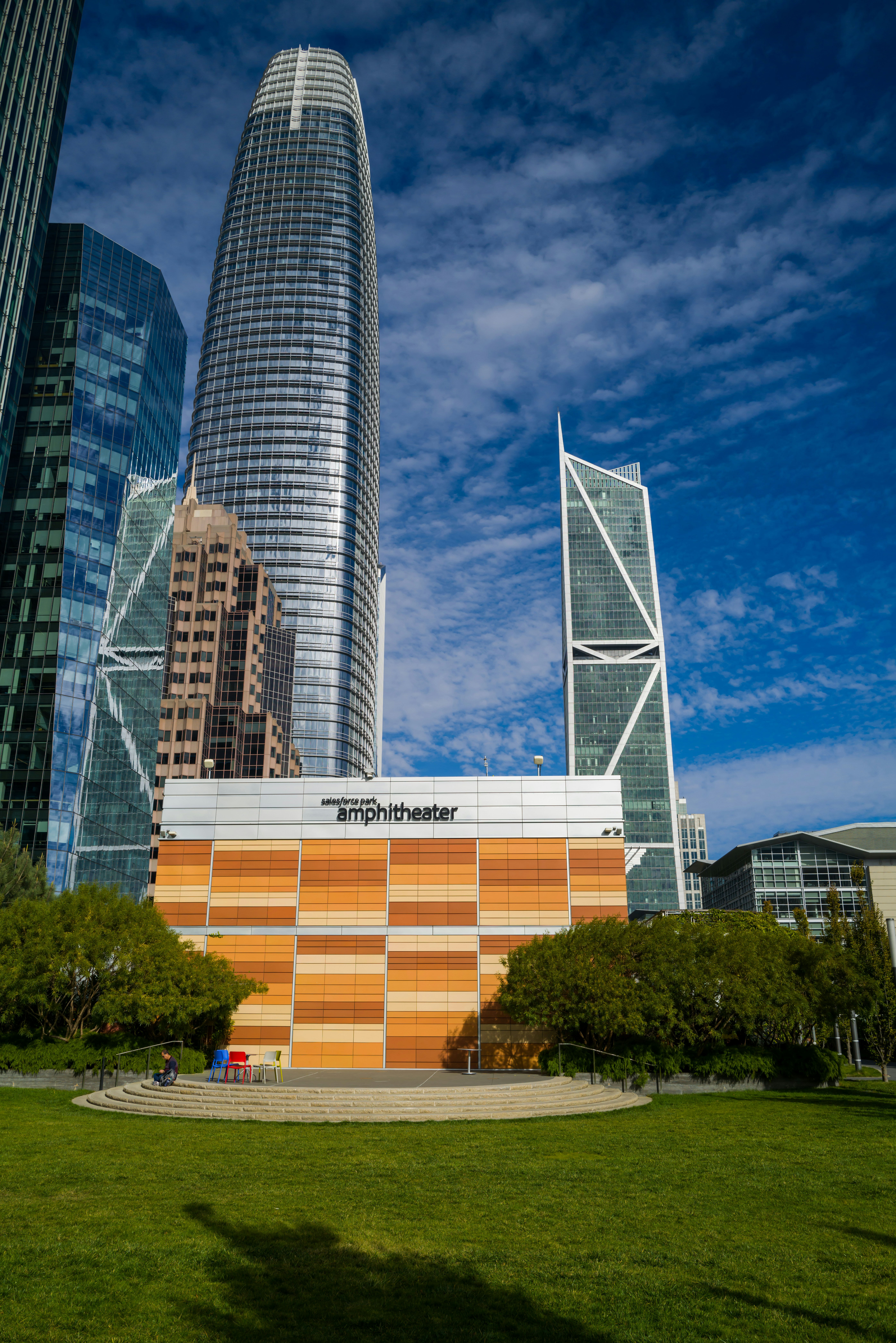 a large building with a lot of tall buildings in the background