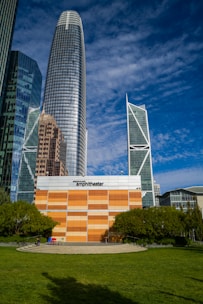 a large building with a lot of tall buildings in the background