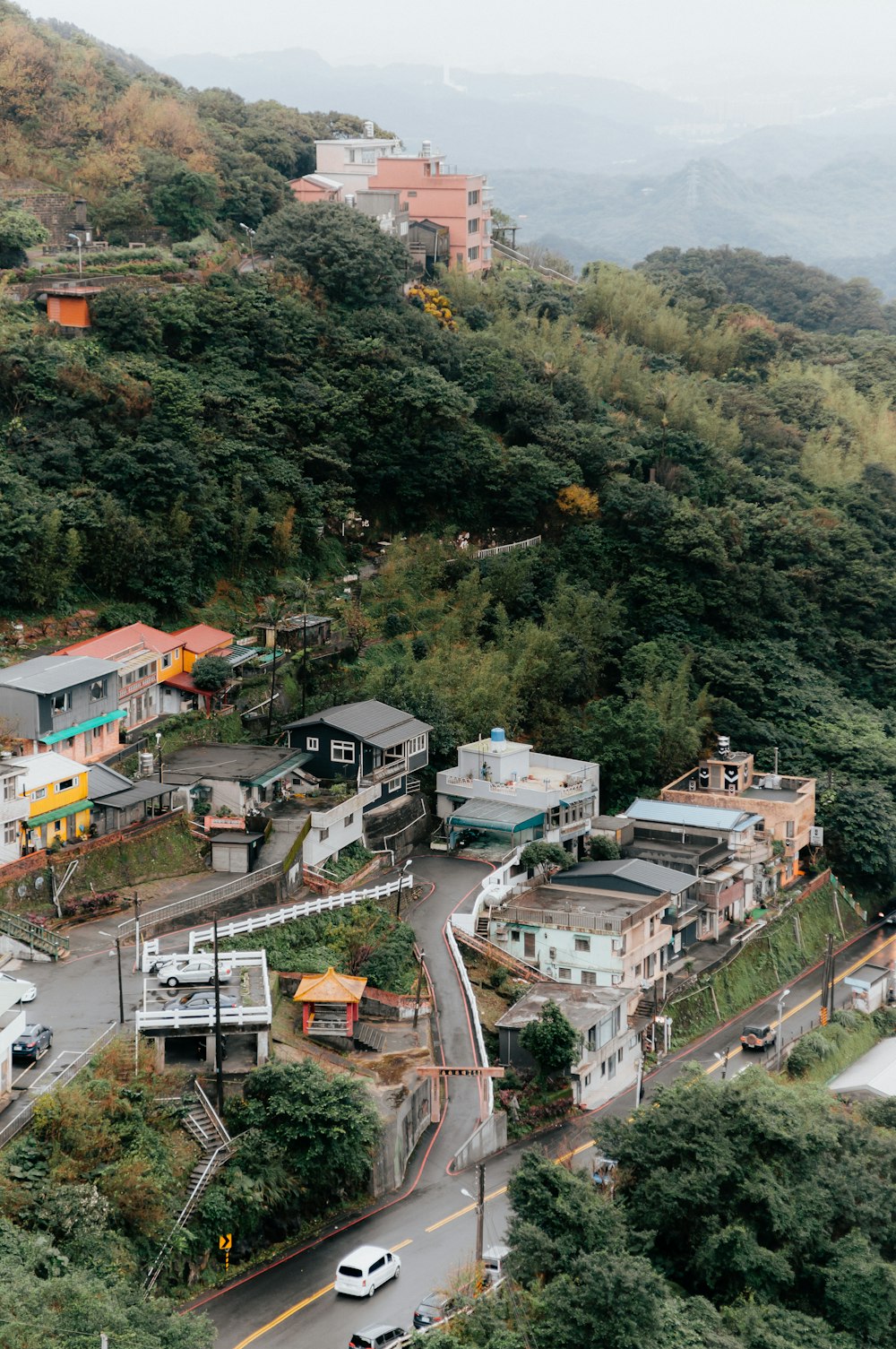 an aerial view of a town on a hill