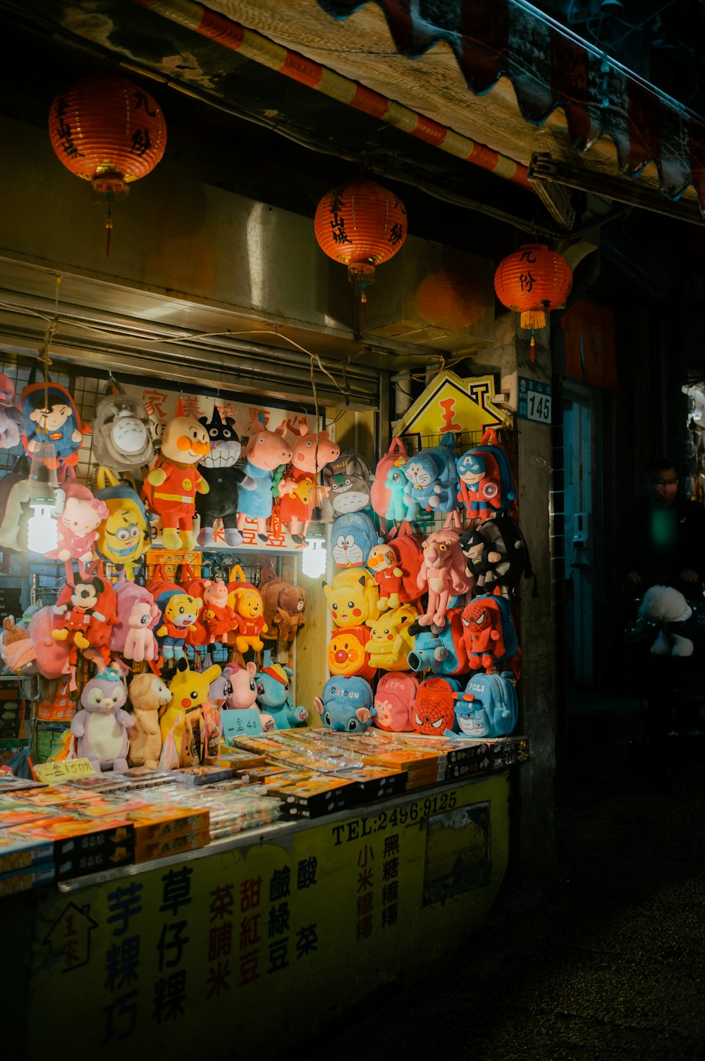 a bunch of stuffed animals on display in a store