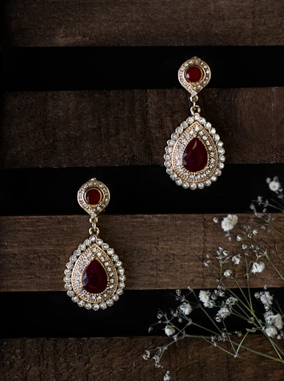 Pair of red and white jhumka earrings