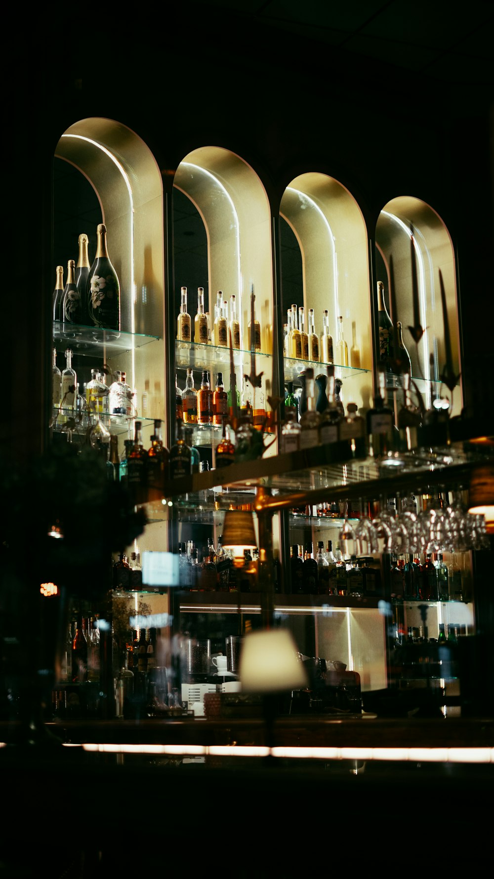 a bar filled with lots of bottles of alcohol