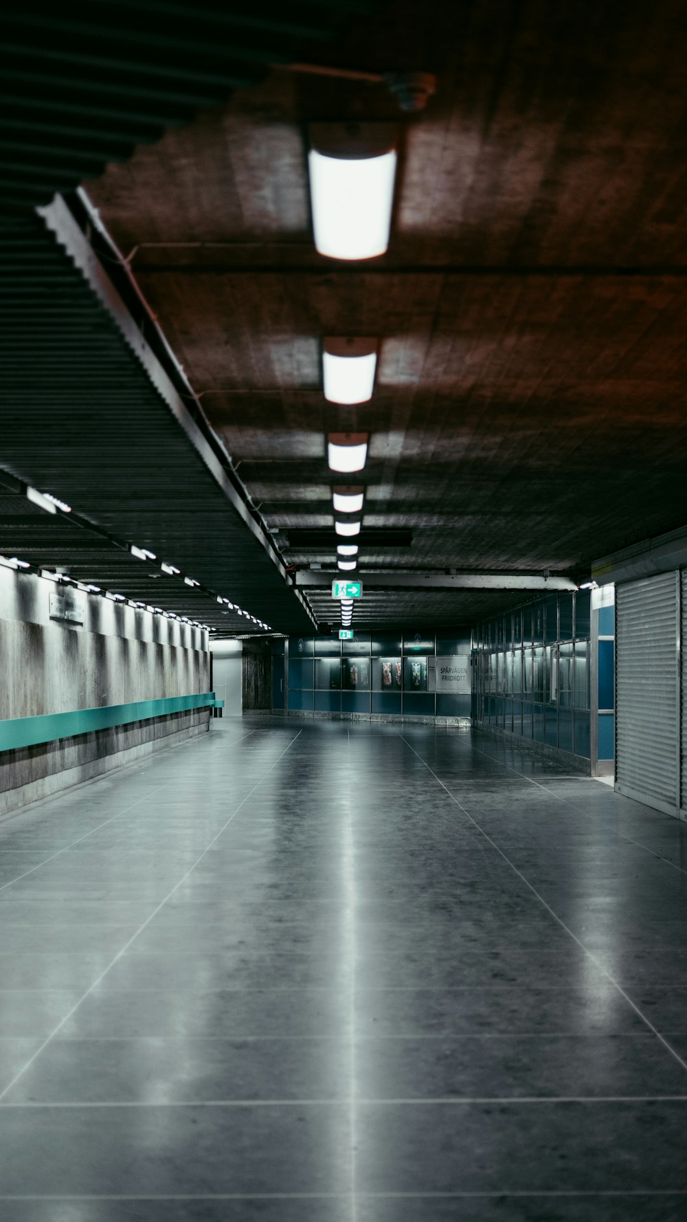 a long hallway with a light on the ceiling