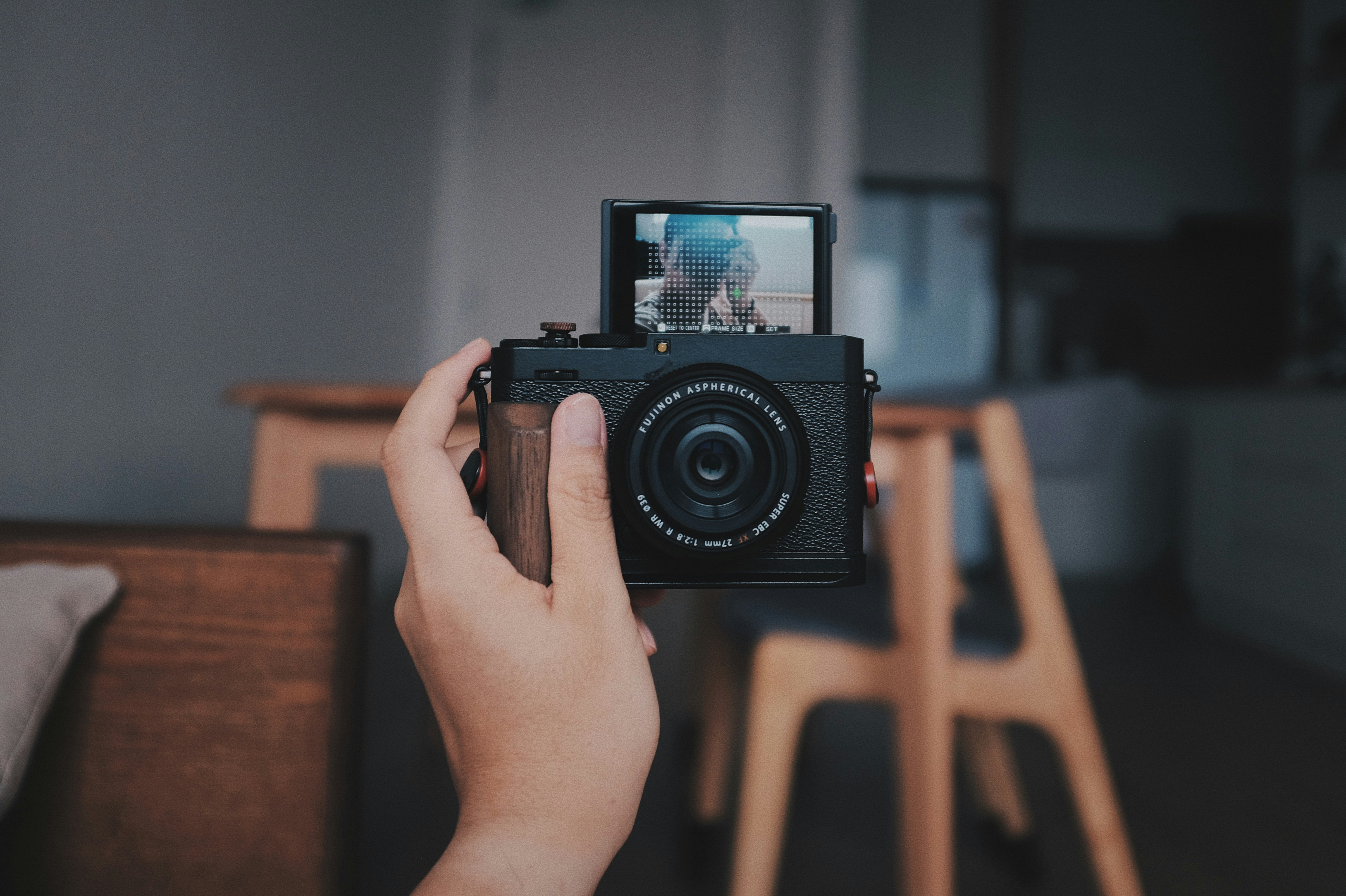 a person holding a camera up to take a picture