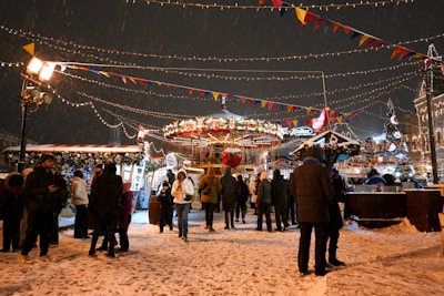 A lively school fair with families enjoying games and festive decorations.