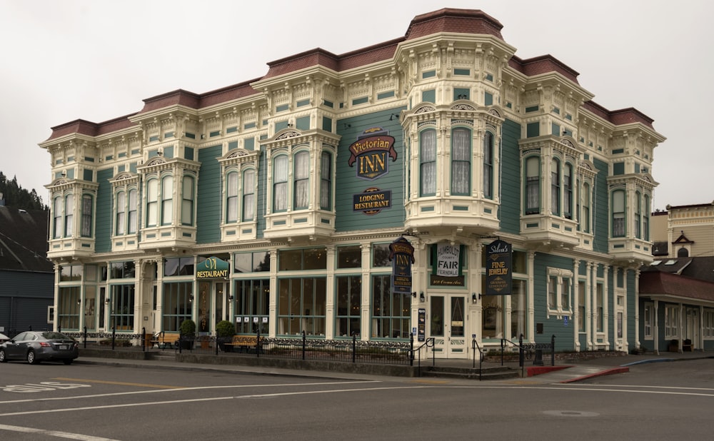 a large building with many windows on a street corner