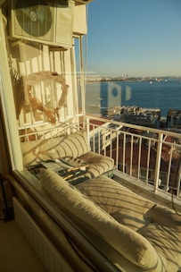 Balcony seating area perfect for morning coffee and relaxation.