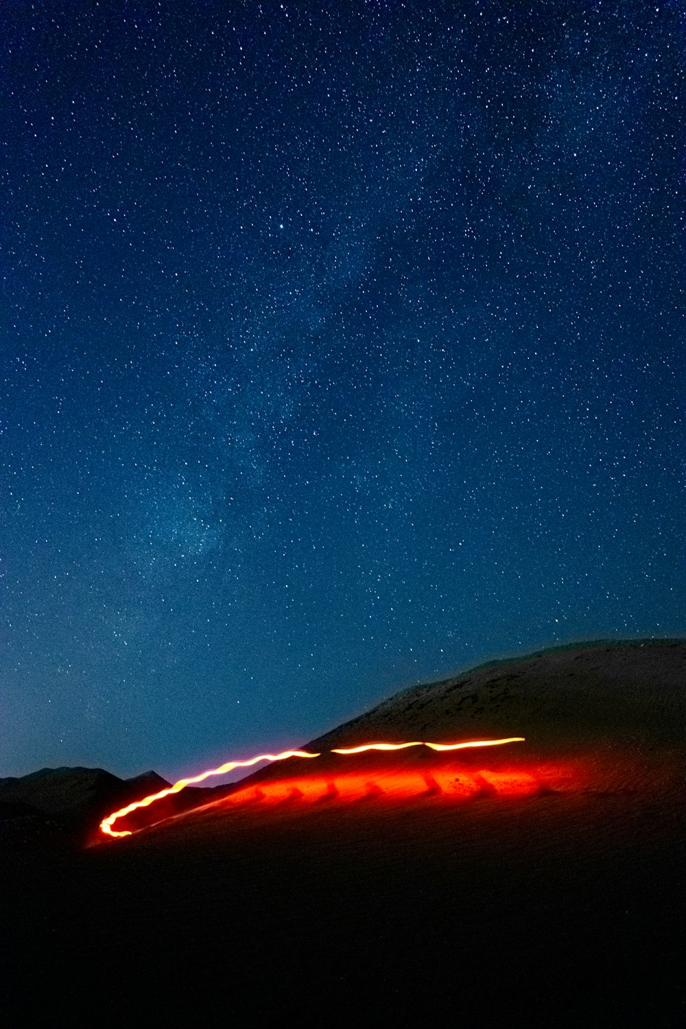 a long exposure photo of the night sky