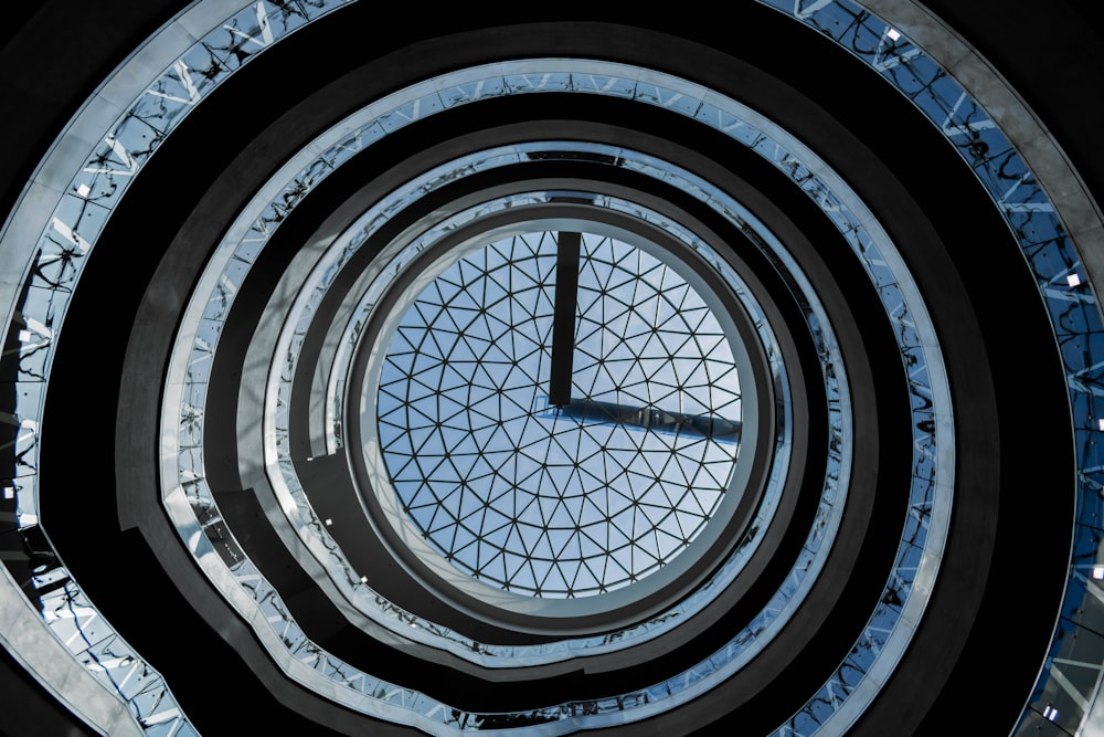 a very tall clock sitting inside of a building