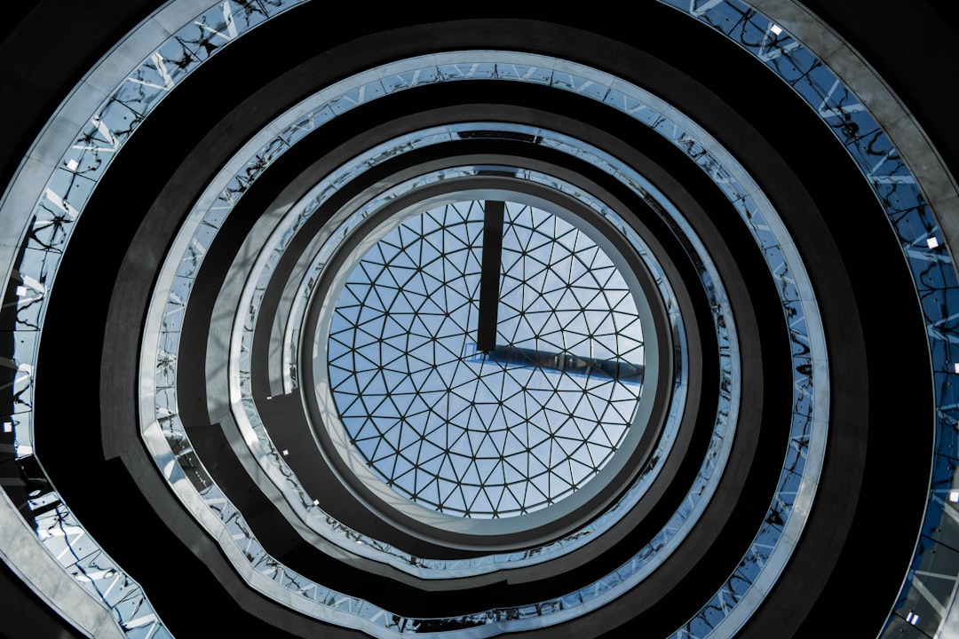 a very tall clock sitting inside of a building,