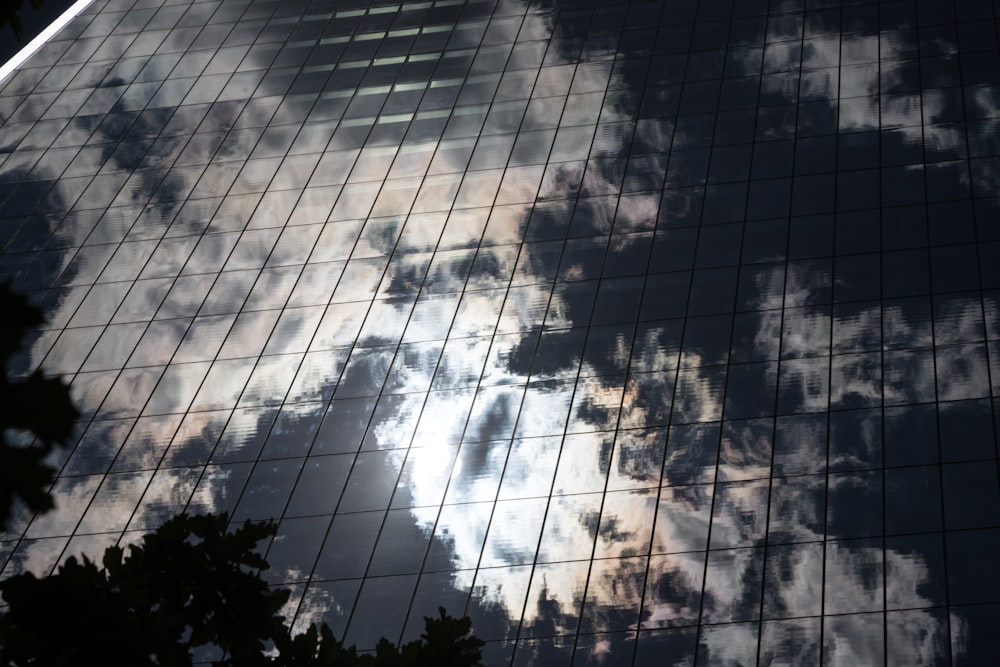 a reflection of a building in the glass of another building