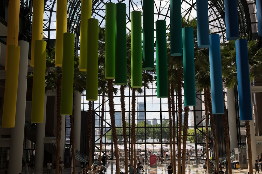 a large building with a bunch of colorful objects hanging from it's ceiling