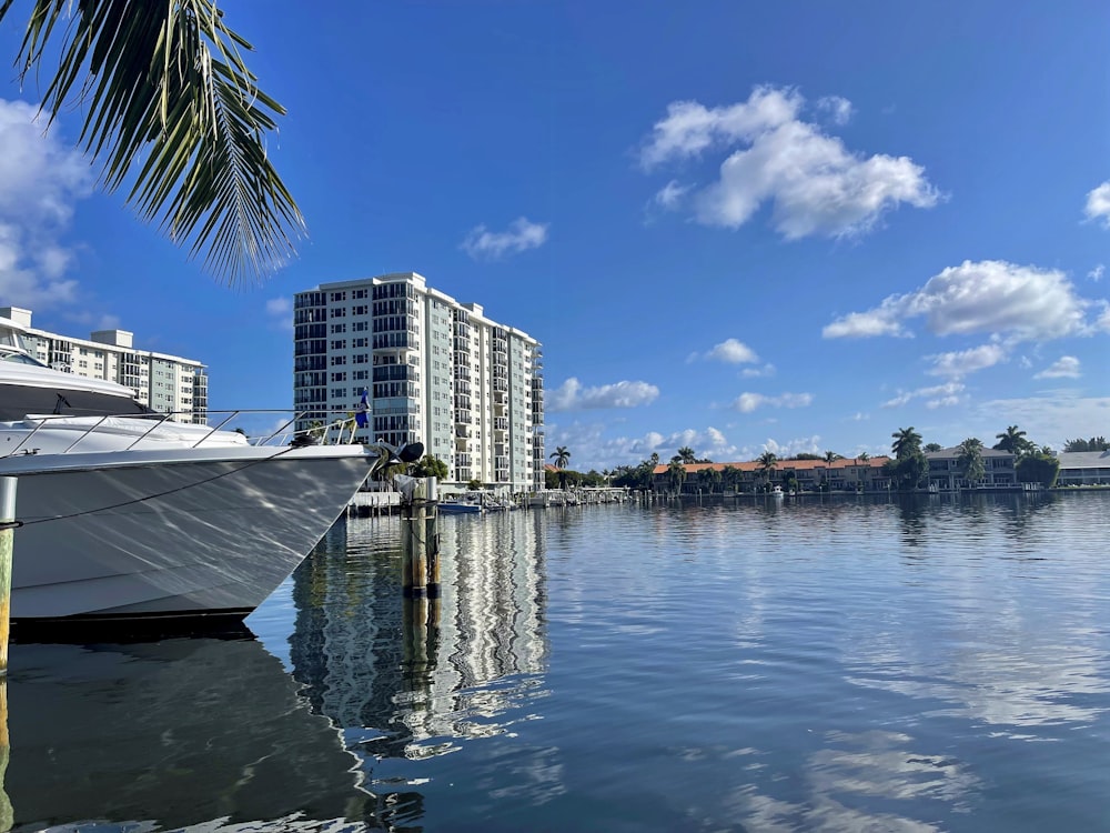 a boat is docked in the water next to a building