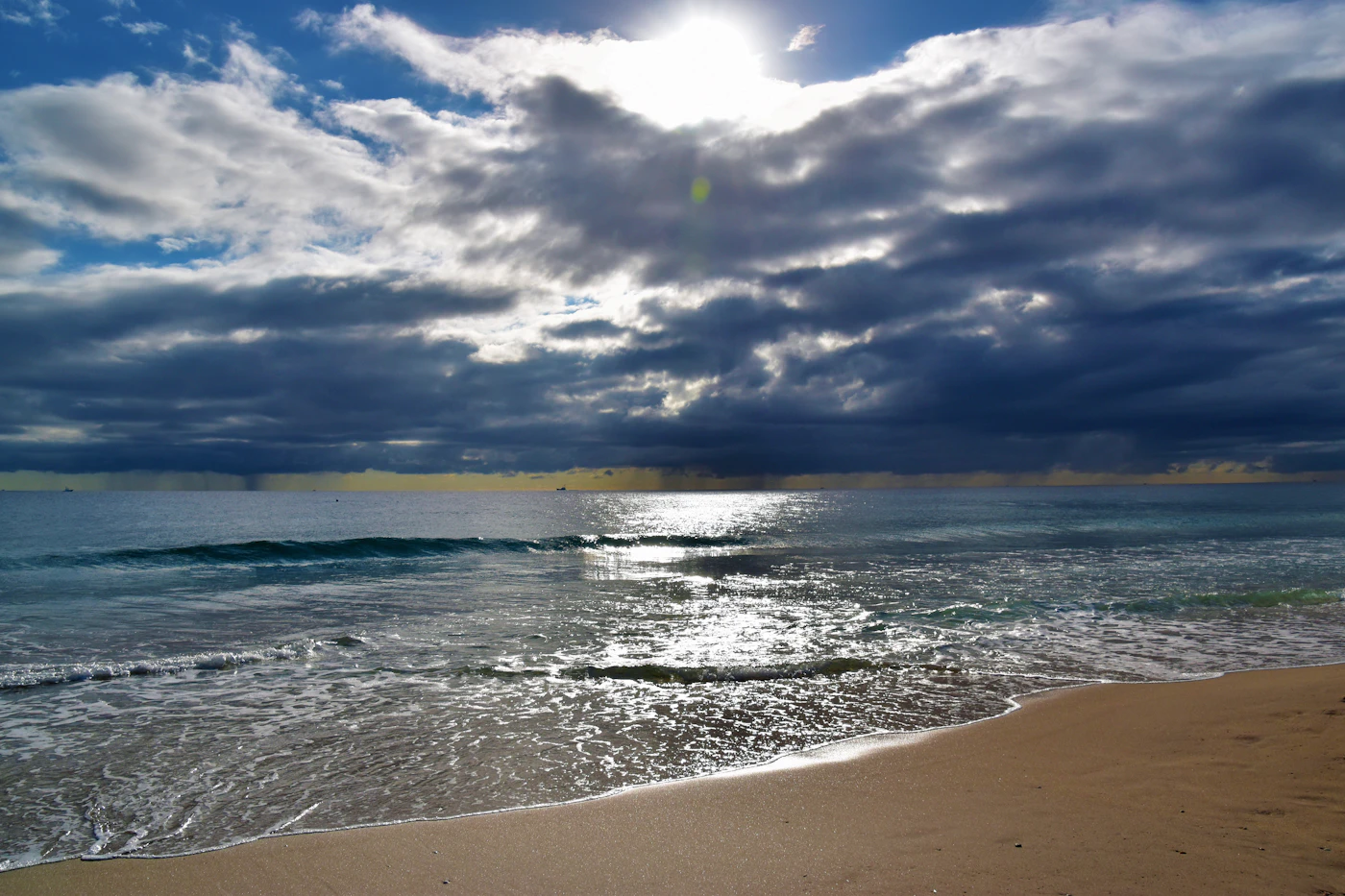 Sun breaking through clouds over Delray Beach
