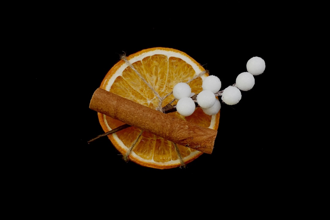 an orange slice with a cigar on top of it