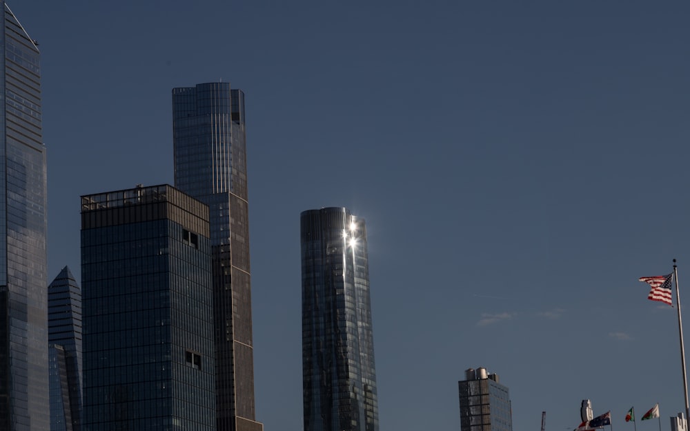 a view of a city with tall buildings and an american flag