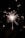 A bright sparkler is being held in a dark setting, with sparks radiating outward and creating a playful, lively atmosphere. The background features soft bokeh circles adding to the festive mood.