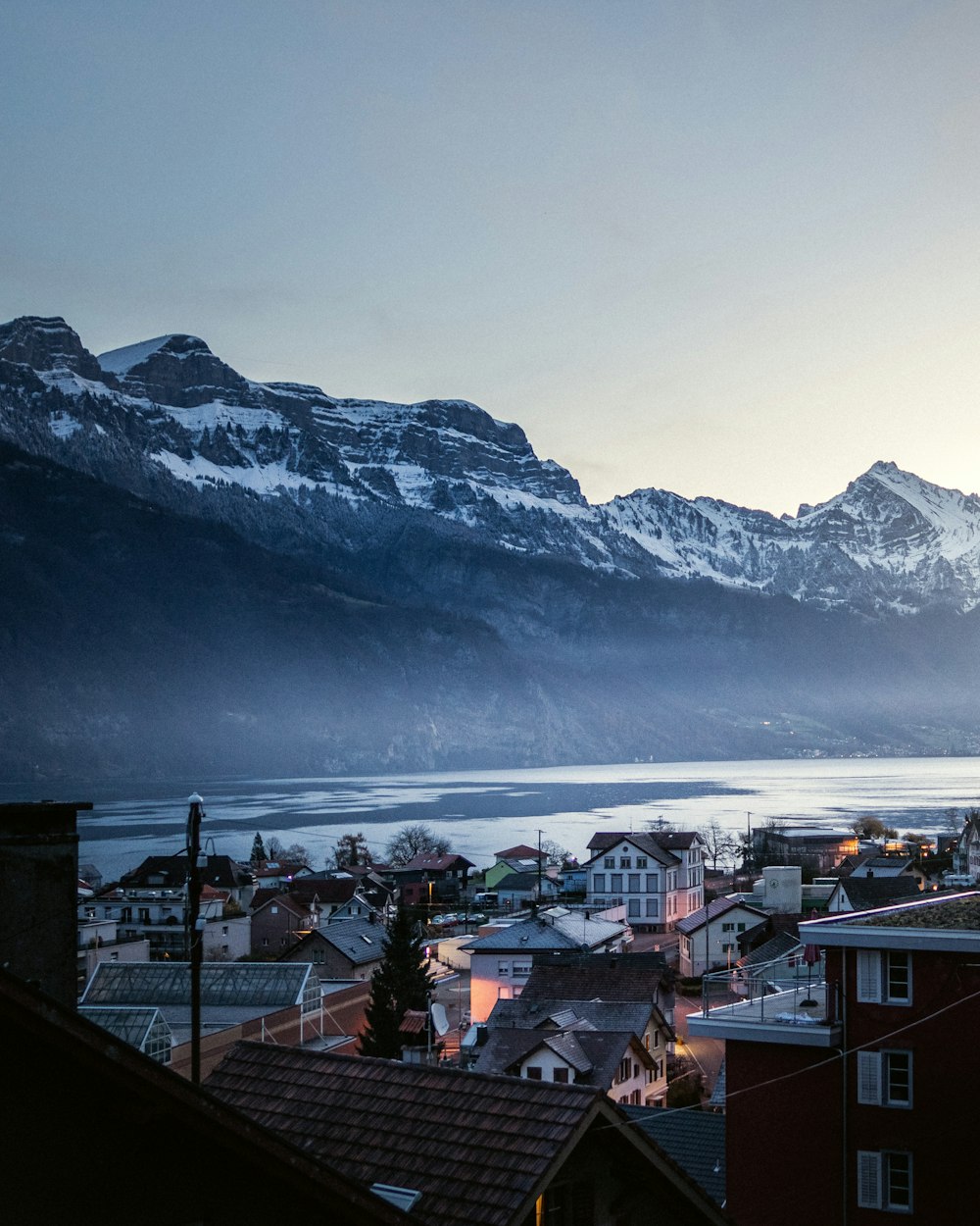 a view of a town with mountains in the background