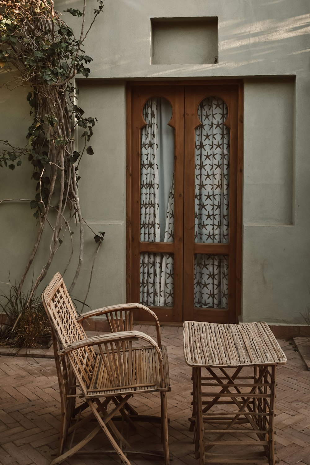 two chairs and a table on a patio