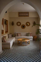 a living room with a checkered floor and a couch