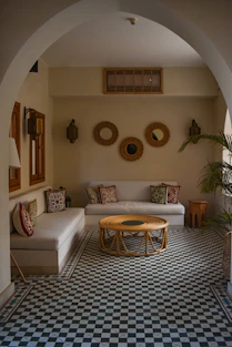 a living room with a checkered floor and a couch