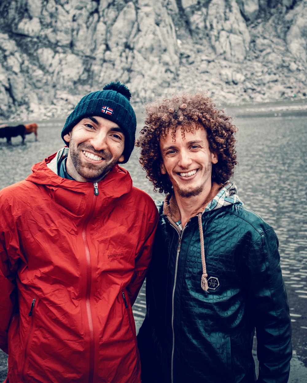 a couple of men standing next to each other