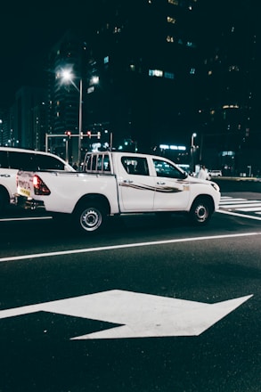 A reliable pickup truck parked in a city street ready for daily rental.