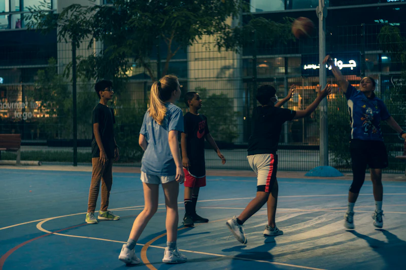 Basketball players jumping for a rebound during a game
