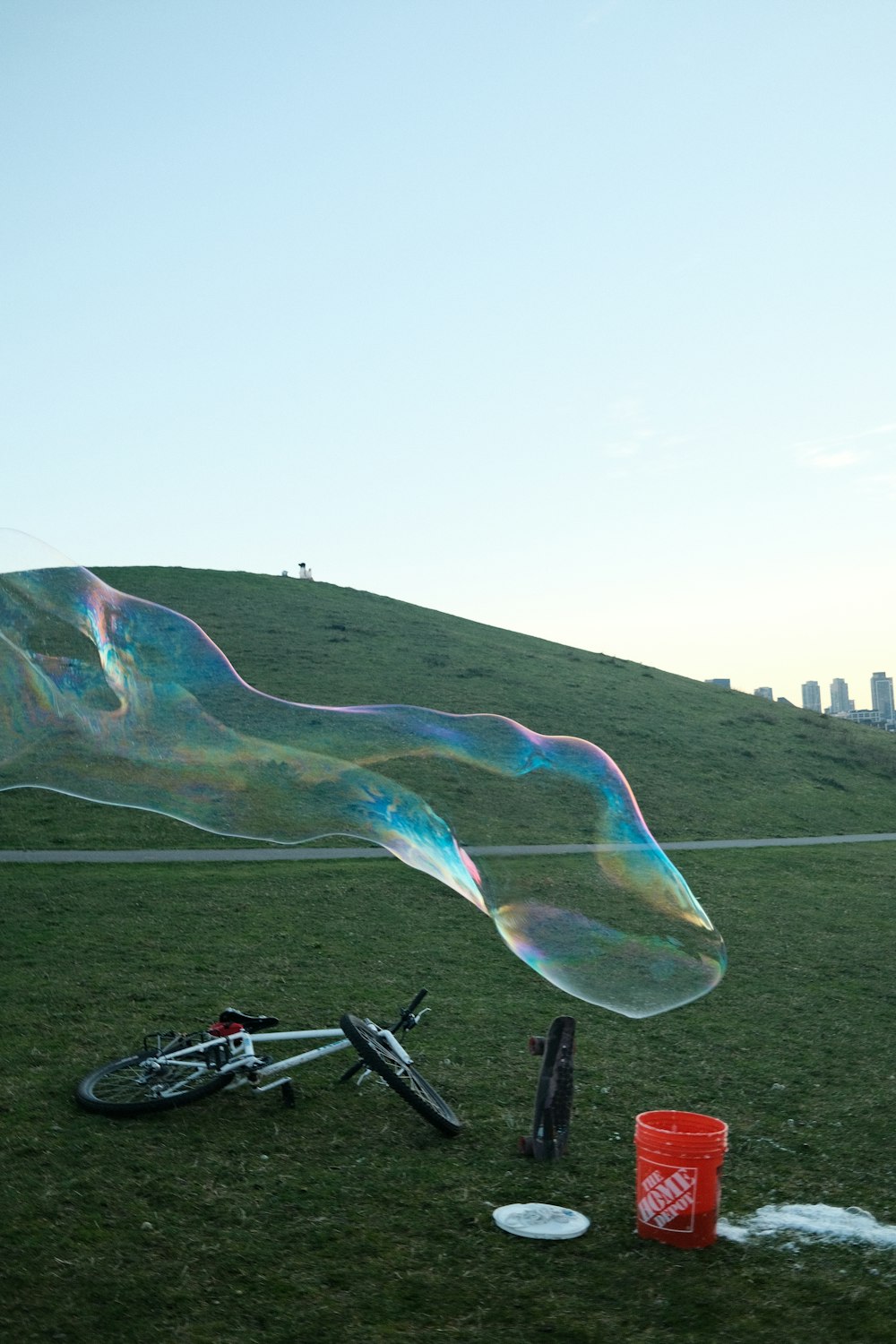 a large bubble is being blown by a bicycle