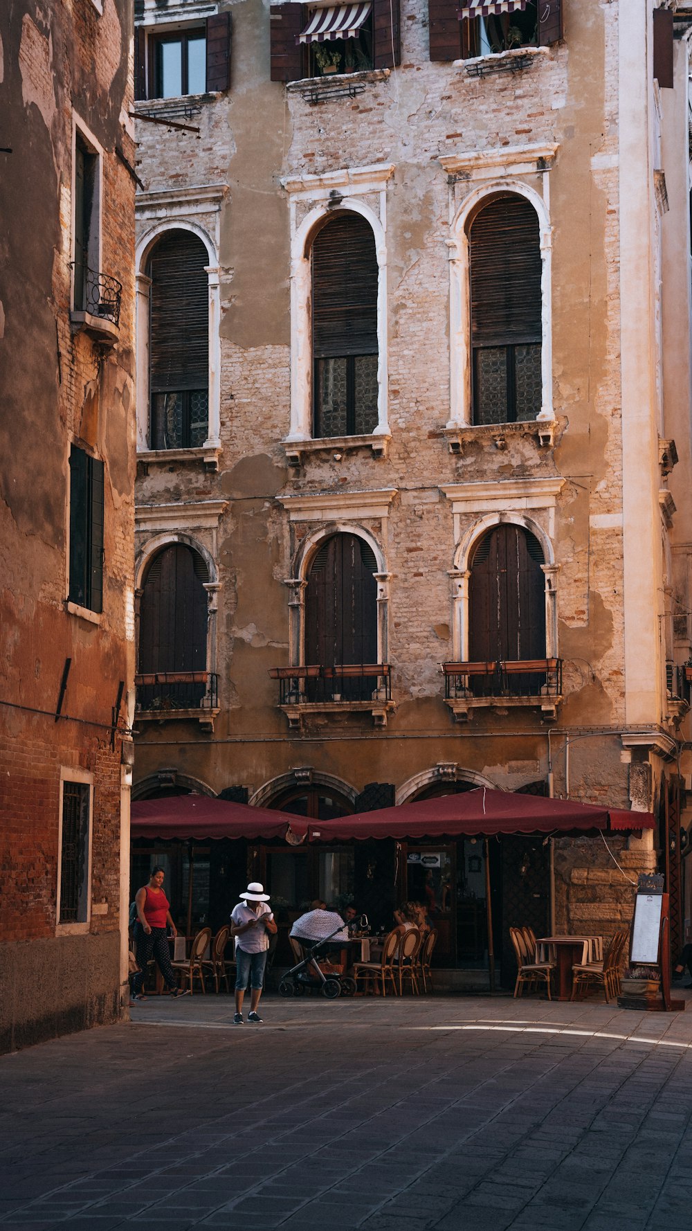 a couple of people standing in front of a building