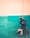 a man is painting a wall with a paint roller