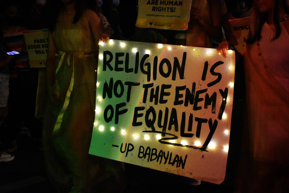 a sign that says religion is not the enemy of equality