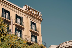 a hotel sign on top of a building