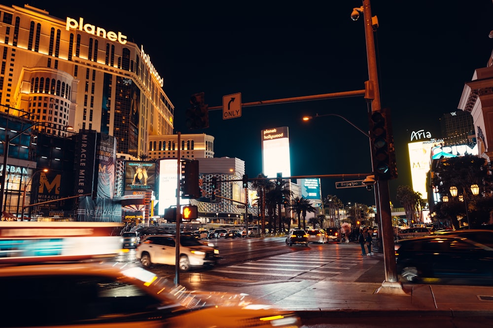 a busy city street at night with a lot of traffic