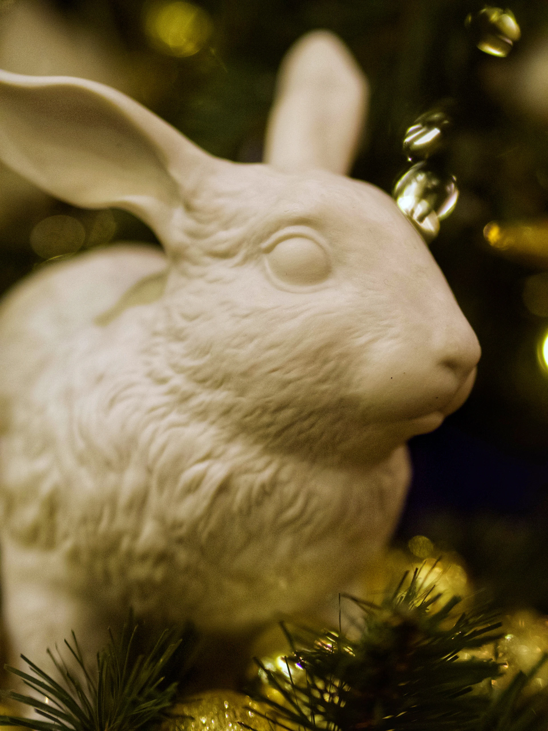 A close-up photo of a whimsical rabbit sculpture from the Królikor art project, bathed in soft natural light.