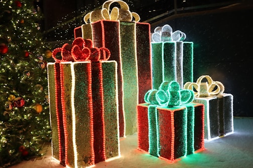a group of presents sitting next to a christmas tree